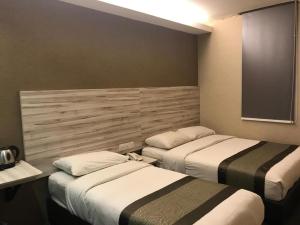 Postel nebo postele na pokoji v ubytování Hotel Austin Paradise - Taman Pulai Utama