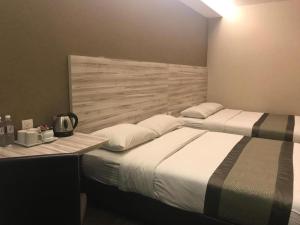 Postel nebo postele na pokoji v ubytování Hotel Austin Paradise - Taman Pulai Utama