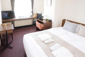 Vuode tai vuoteita majoituspaikassa Pod Select Hotel Shinjuku