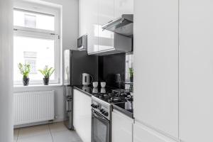 Kuchyňa alebo kuchynka v ubytovaní Parkowa 33 Apartment Sopot