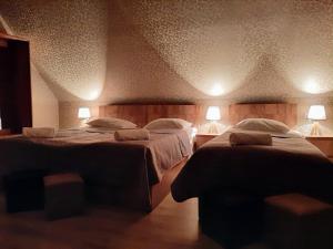A bed or beds in a room at Kazbegi Inn
