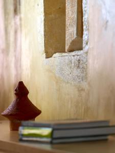 a book sitting on a table next to a window at Dorotheou House in Chania