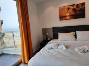 Postel nebo postele na pokoji v ubytování Hotel Shoreline