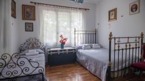 Postel nebo postele na pokoji v ubytování Kitries Home