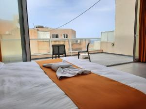 Postel nebo postele na pokoji v ubytování Hotel Shoreline