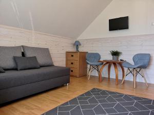 a living room with a couch and a table at Willa u Tośka in Kołobrzeg