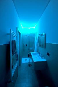 a bathroom with a blue light on the ceiling at OASI PA.CI. COUNTRY HOUSE in Montemiletto