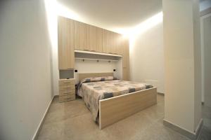 a bedroom with a bed and a dresser in it at OASI PA.CI. COUNTRY HOUSE in Montemiletto