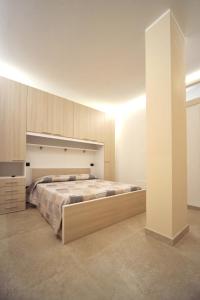 a bedroom with a large bed in a room at OASI PA.CI. COUNTRY HOUSE in Montemiletto