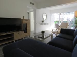 Televízia a/alebo spoločenská miestnosť v ubytovaní Casa Sur