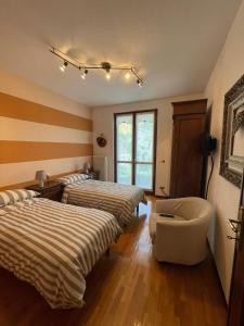 Postel nebo postele na pokoji v ubytování B&B Gli Ulivi