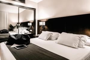Cama o camas de una habitación en HO Ciudad de Jaén
