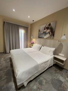 Cama ou camas em um quarto em MIKE'S STUDIOS