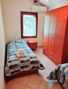 Posteľ alebo postele v izbe v ubytovaní Casa Colonna Montegrotto terme