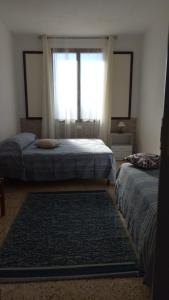 A bed or beds in a room at Casa Minerva Favignana -Cala rotonda