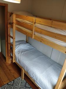 a couple of bunk beds in a room at Town Centre House with parking in Cheltenham