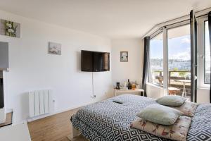 Кровать или кровати в номере Deauville-Port - Escapade Deauvillaise dans un charmant studio