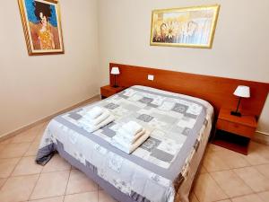 Posteľ alebo postele v izbe v ubytovaní Casa Colonna Montegrotto terme