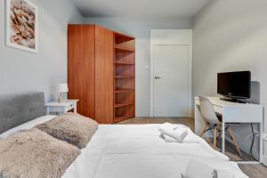 Posteľ alebo postele v izbe v ubytovaní Dom & House - Apartamenty Nadmorski Dwór
