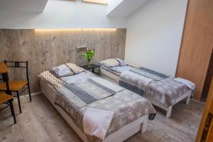 A bed or beds in a room at Gdynia noclegi NaFali Rewa