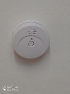 a white button on the ceiling of a room at Petrino in Kalamata