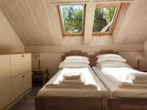 Katil atau katil-katil dalam bilik di Mazursko - Apartamenty
