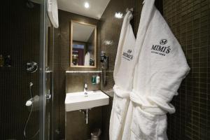a bathroom with a sink and a towel at Mimi's Hotel Soho in London