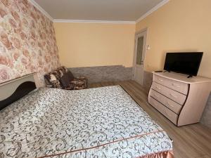 Кровать или кровати в номере Apartment Lenina 10