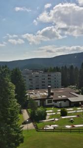 a large building with a park in front of it at Ferienwohnung Bergwichtel Hahnenklee "super Aussicht" in Hahnenklee-Bockswiese