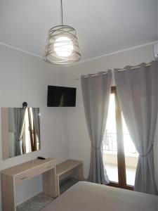 Posteľ alebo postele v izbe v ubytovaní Sandra's Studios
