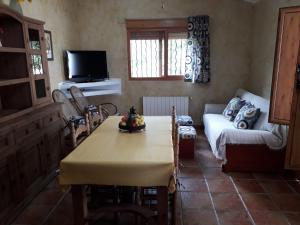 A television and/or entertainment centre at CASITA RUSTICA DE INVITADOS (NEXT TO XATIVA)