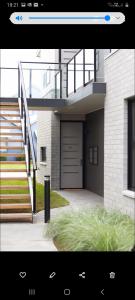 a picture of a house with a garage at Captains Cove Ground Floor Luxury Apartments in Paynesville