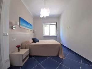 Postel nebo postele na pokoji v ubytování Blue House