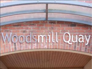 a sign on a brick building that reads woodmill curry at Woodsmill Quay Apartments in York