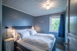 
En eller flere senger på et rom på Hustadvika Guesthouse - by Classic Norway Hotels
