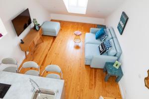 an overhead view of a living room with a blue couch at Lisbon Chillout Apartments in Lisbon