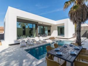 an image of a villa with a swimming pool at Villa Blanca in L'Escala