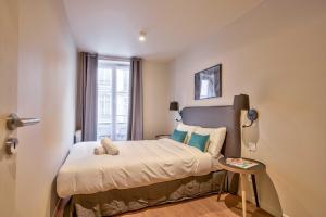 Posteľ alebo postele v izbe v ubytovaní 02 - Urban Exclusive in Montorgueil