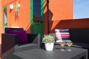 Nápoje v ubytovaní Home2Book Relax Apartment Buenavista