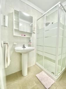 a bathroom with a sink and a shower at Home2Book Relax Apartment Buenavista in Buenavista del Norte