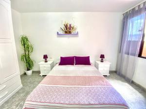 Ένα ή περισσότερα κρεβάτια σε δωμάτιο στο Home2Book Relax Apartment Buenavista