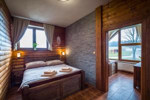 Postel nebo postele na pokoji v ubytování Ranch Jestřebice