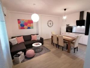 a living room with a couch and a table at Apartments Pepe in Novigrad Istria