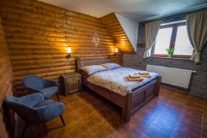 Postel nebo postele na pokoji v ubytování Ranch Jestřebice