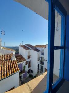 a view from a window of a building with roofs at Casa David in Frigiliana