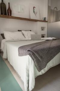 En eller flere senge i et værelse på Relais Bellavista 5