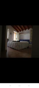 a large room with a bed in the middle of it at Appartamento il pozzo in Lecco