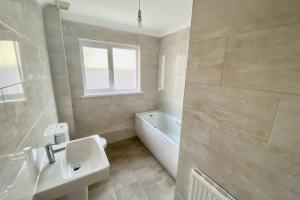 Et badeværelse på Stockwood Holiday Bungalow + 10 billeder