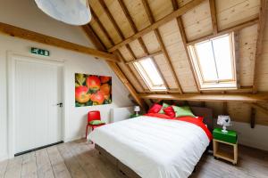 Ένα ή περισσότερα κρεβάτια σε δωμάτιο στο De Nachtdijk