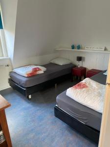 Кровать или кровати в номере Appartement De Kaai